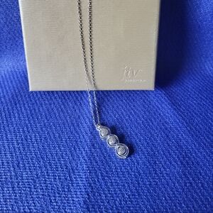 Round drop white diamond rhodium 925 sterling silver pendant with chain.